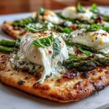 Vibrant Roasted Asparagus Flatbread topped with melting burrata and bright lemon.