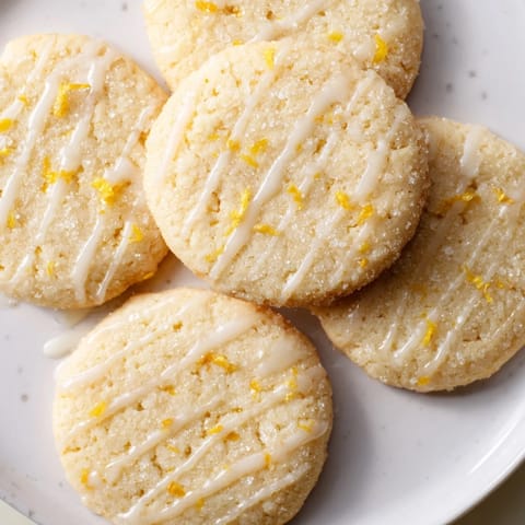 Golden, glistening Lemon Sugar Cookies, rolled in sparkling sugar, ready to be enjoyed.